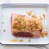 Seasoning a corned beef.