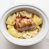 Finished corned beef and cabbage in a slow cooker.