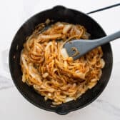 Caramelizing onions in a cast iron pan.