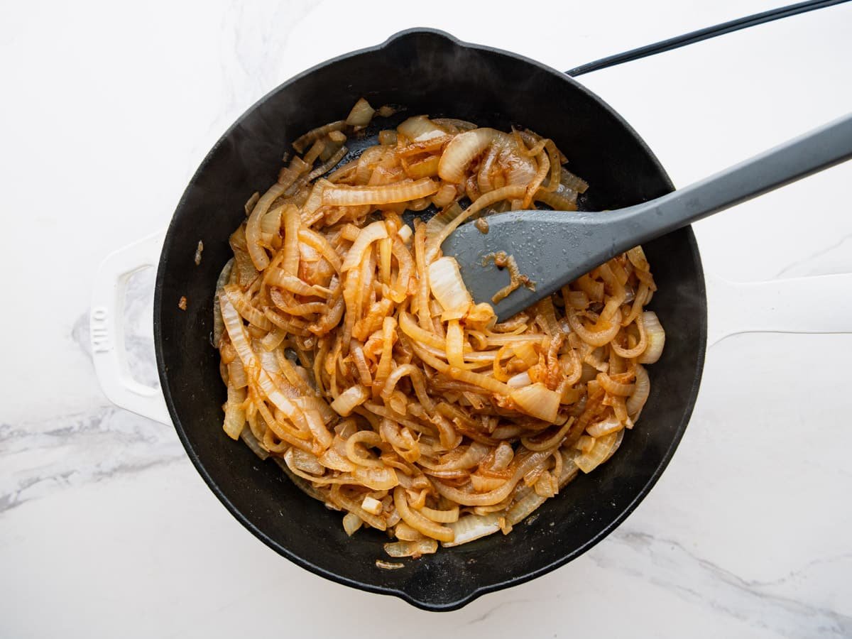 Caramelizing onions in a cast iron pan.
