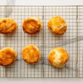 Cooked biscuits on a cooling rack.