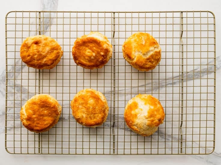 Cooked biscuits on a cooling rack.