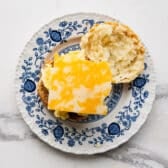 Adding the cheese to the sandwich.