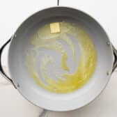 Melting butter in a skillet.