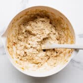 Stirring together the filling for cream cheese chicken enchiladas.