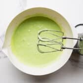 Mixing the cake batter with an electric hand mixer.