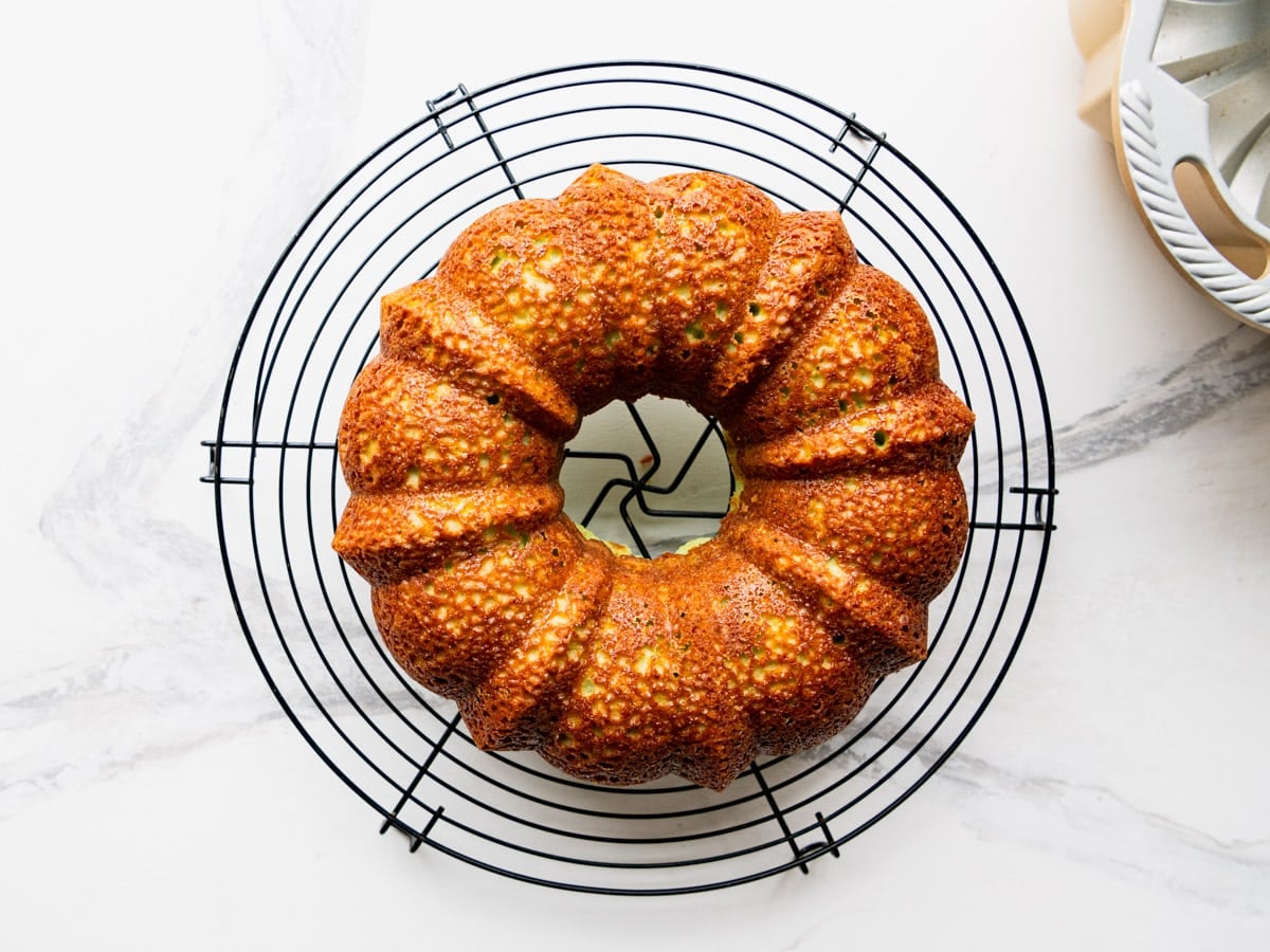 Key lime bundt cake cooling on a wire rack.