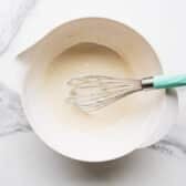 Whisking together the key lime glaze.