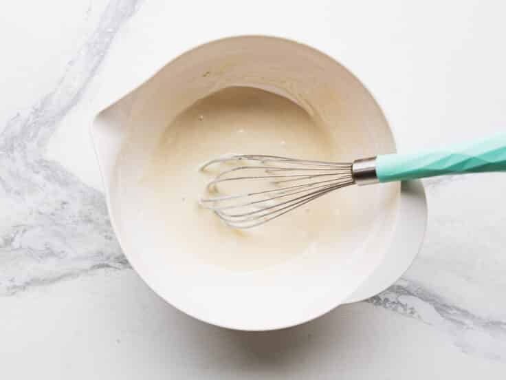 Whisking together the key lime glaze.