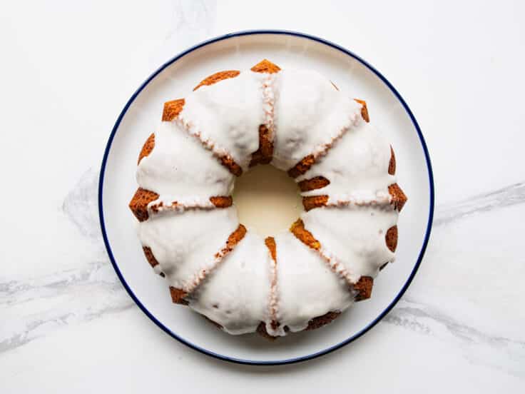 Adding the glaze to a key lime bundt cake.