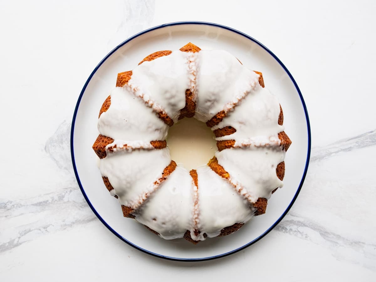Adding the glaze to a key lime bundt cake.