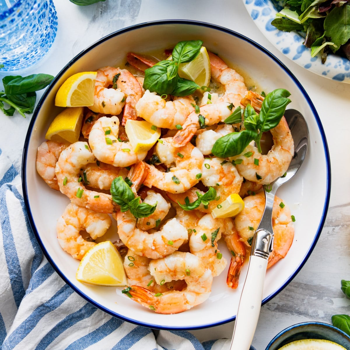 Square overhead shot of a bowl of lemon garlic shrimp.