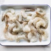Raw shrimp on a tray.