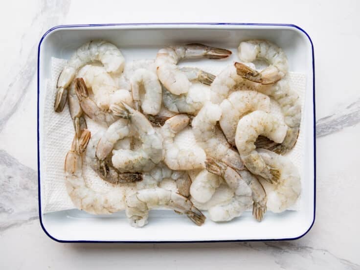 Raw shrimp on a tray.