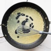 Whisking and simmering the lemon sauce.