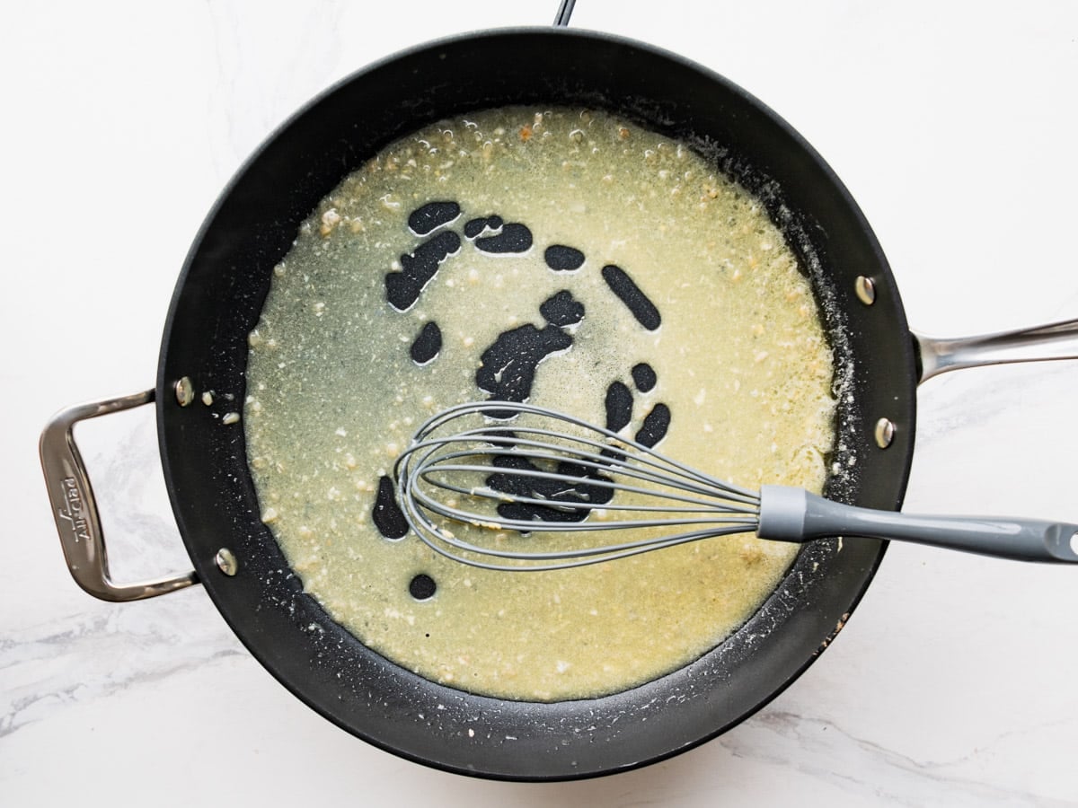 Whisking and simmering the lemon sauce.