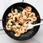 Tossing the shrimp in the lemon garlic shrimp.