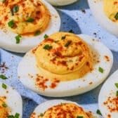 Square side shot of Southern deviled eggs on a blue serving tray.