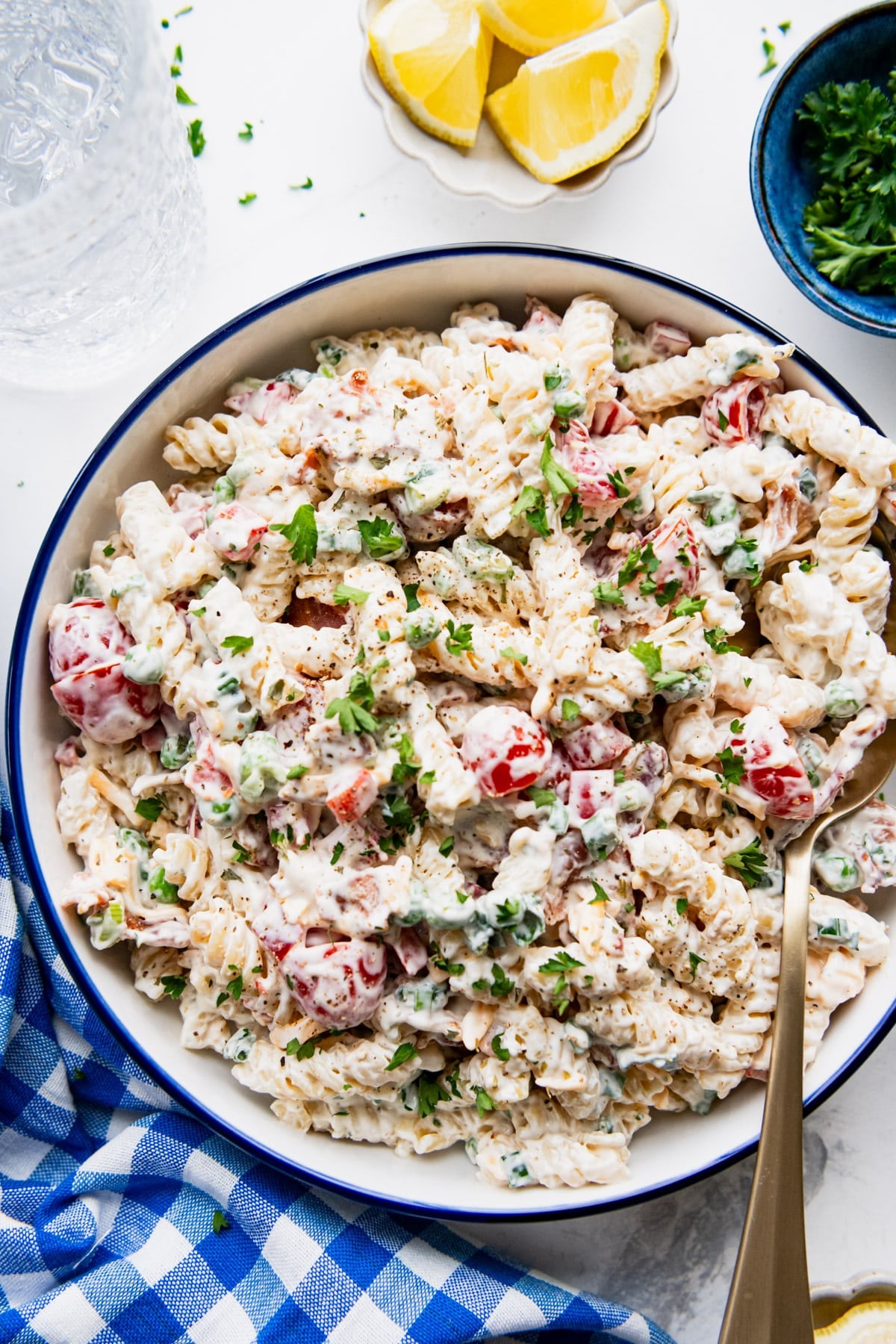 Close overhead image of a bowl of creamy bacon ranch pasta salad.