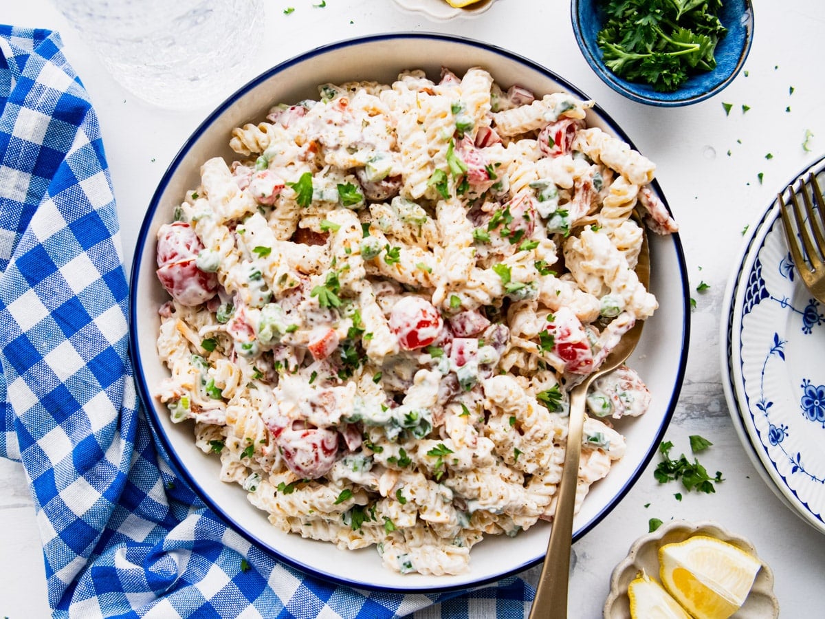 Horizontal overhead image of a bowl of creamy bacon ranch pasta salad.