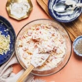 Stirring together pimento cheese.