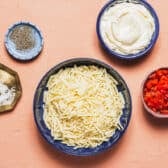 Ingredients for a homemade pimento cheese recipe.