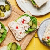 Horizontal overhead shot of pimento cheese spread on bread for sandwiches.