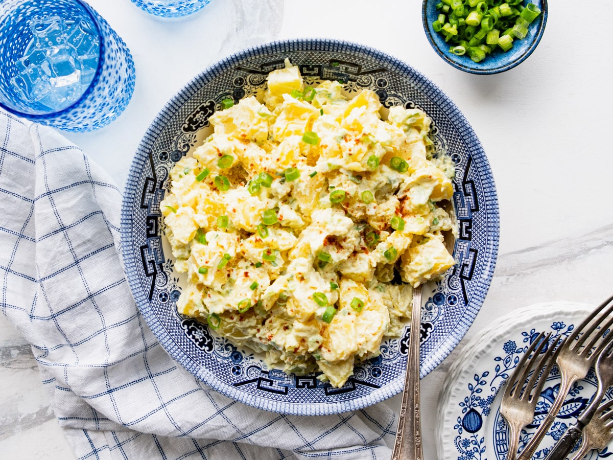 Horizontal overhead shot of a bowl of southern style potato salad.