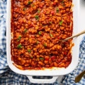 Square overhead shot of a dish of bbq baked beans.