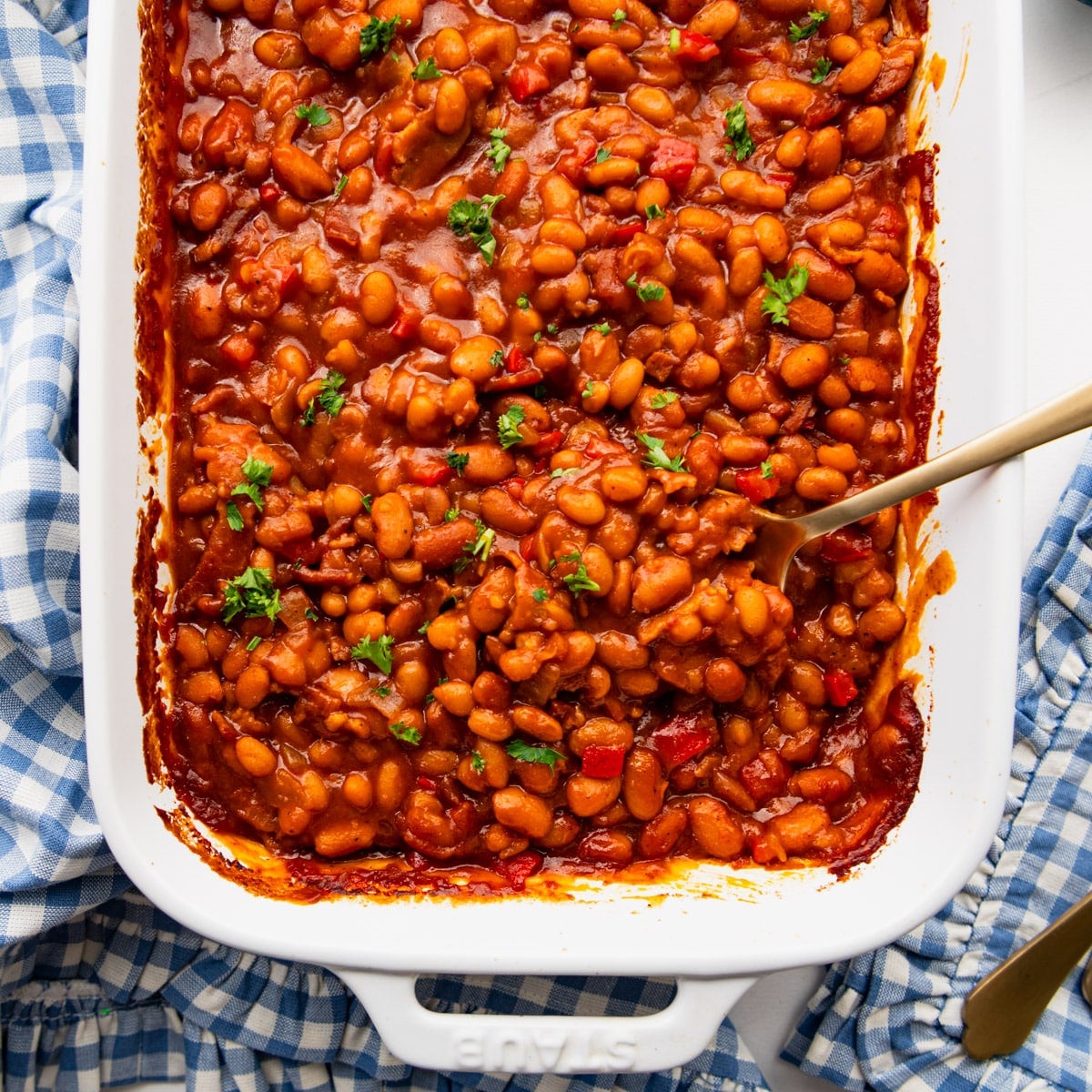 Square overhead shot of a dish of bbq baked beans.