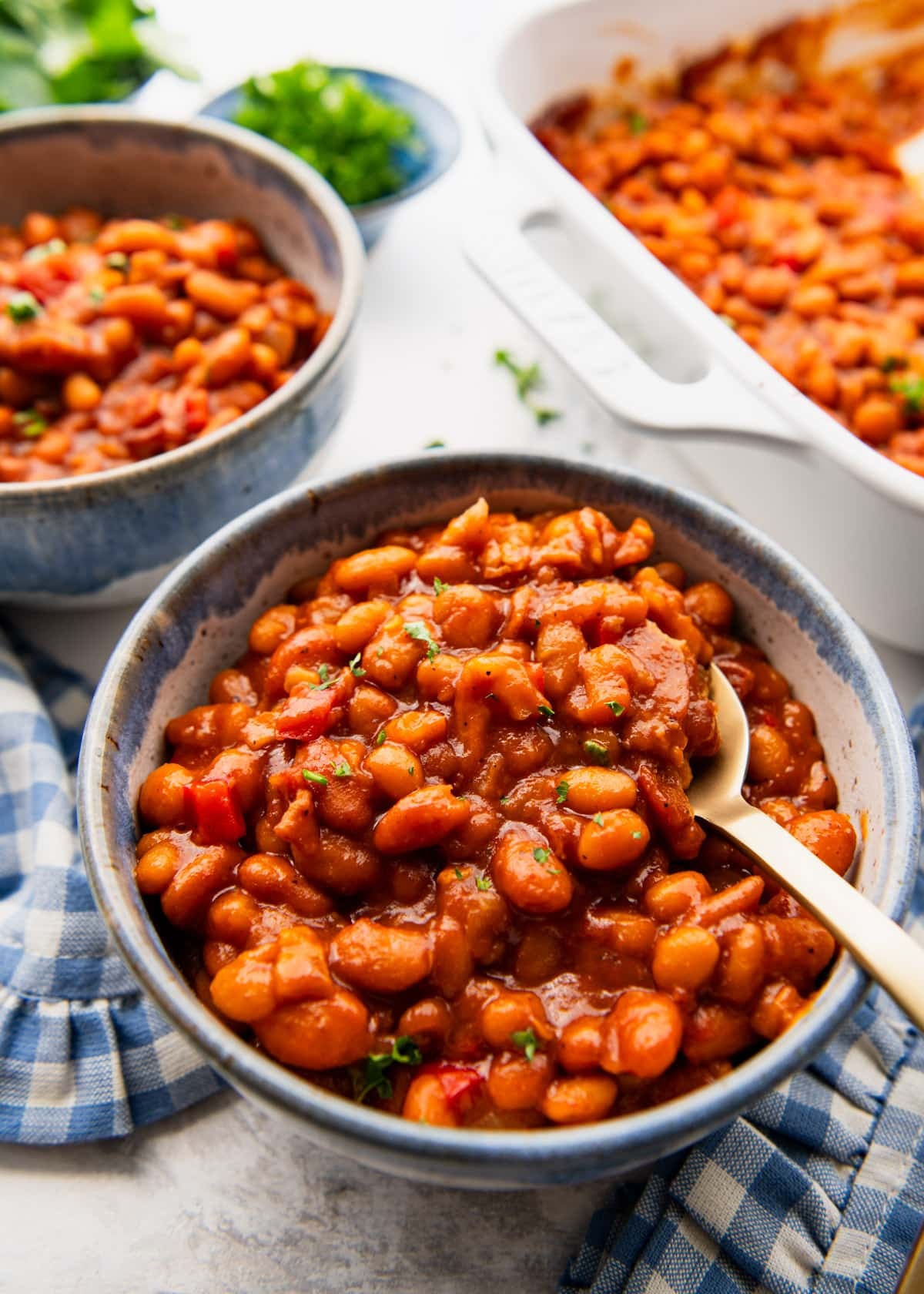 Spoon in a bowl of easy bbq baked beans.