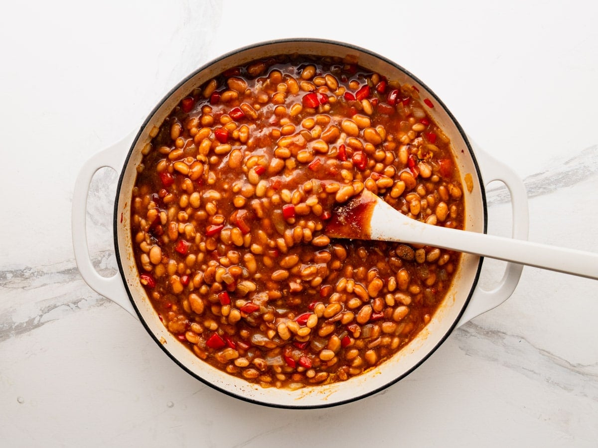 Process shot showing how to make bbq baked beans.