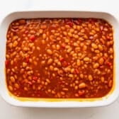 BBQ baked beans in a dish before they go in the oven.