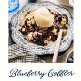 Blueberry cobbler with cake mix and a text title at the bottom.