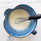 Whisking together the creamy dressing.