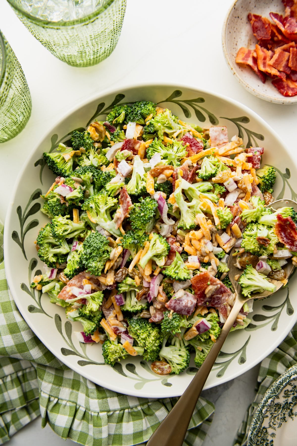 Close overhead shot of a bowl of broccoli salad with bacon.
