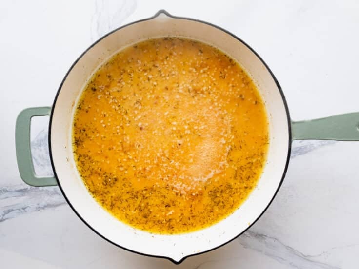Simmering the pan sauce.