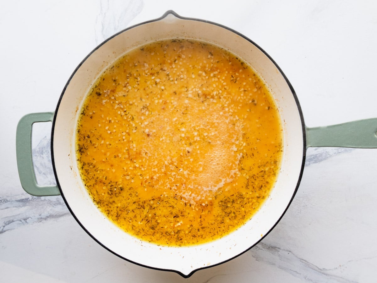 Simmering the pan sauce.