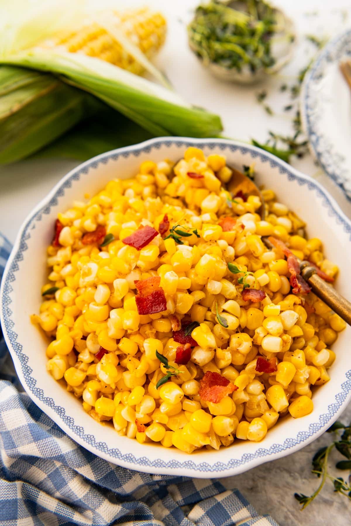 Side shot of a bowl of fried corn.