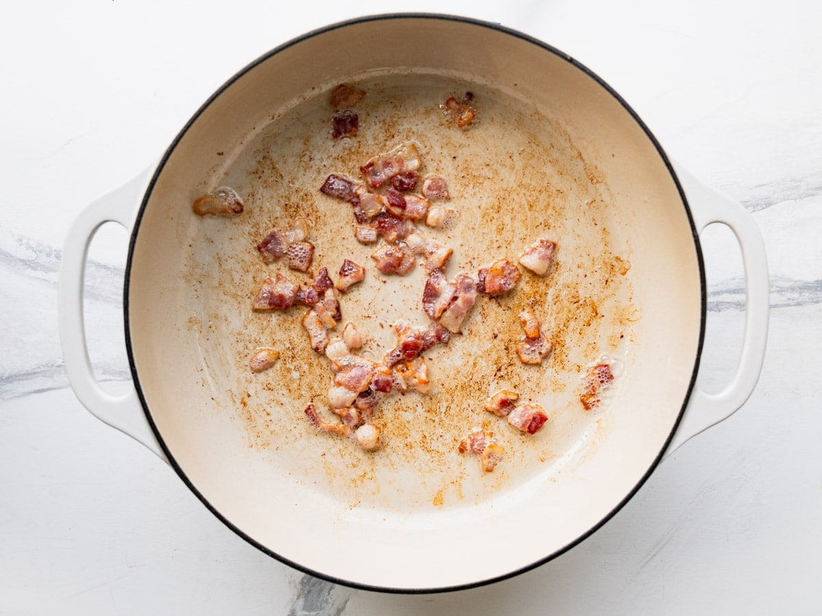 Frying bacon in a skillet.
