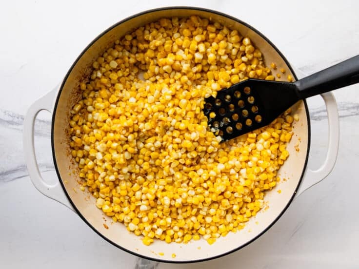Frying corn in a skillet.