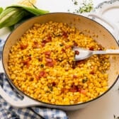 Horizontal side shot of a skillet of Southern fried corn.