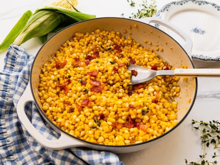 Horizontal side shot of a skillet of Southern fried corn.