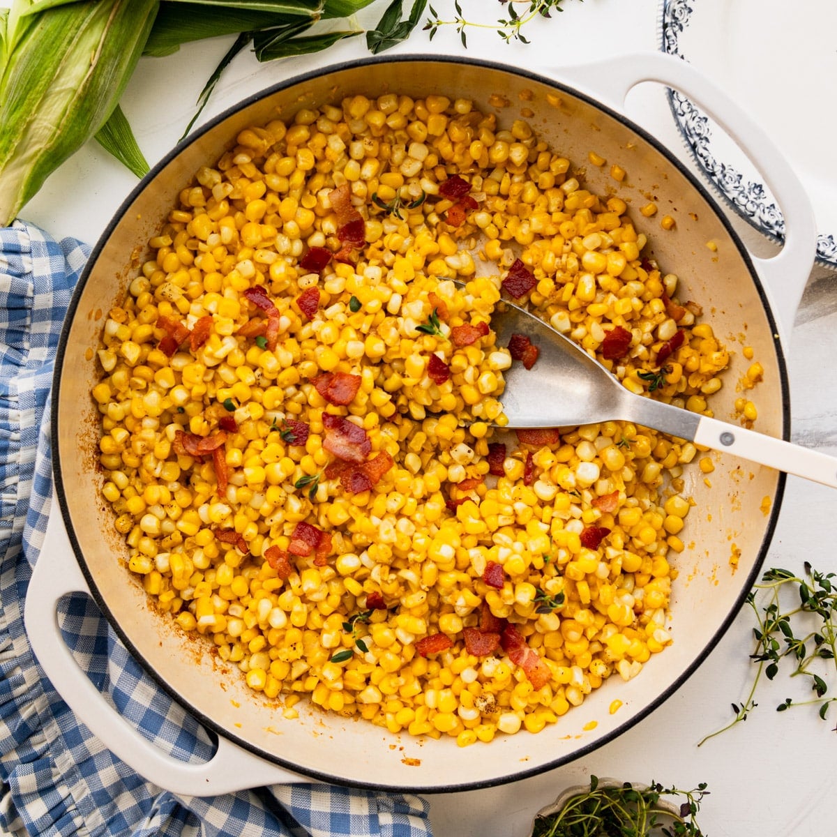 Square overhead shot of a skillet of Southern fried corn.
