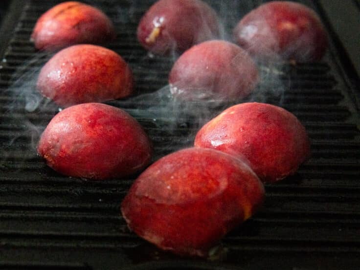 Process shot showing how to grill peaches.