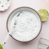 Cilantro lime crema in a small bowl.