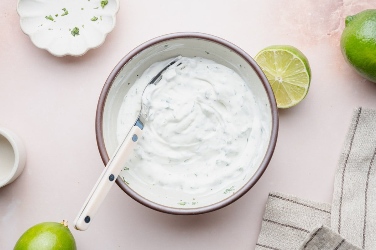 Cilantro lime crema in a small bowl.