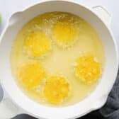 Frying green tomatoes in a skillet.
