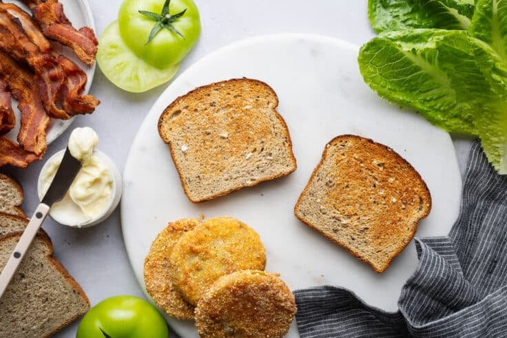 Toasted bread on a white plate.