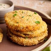Square side shot of Southern fried green tomatoes on a plate.